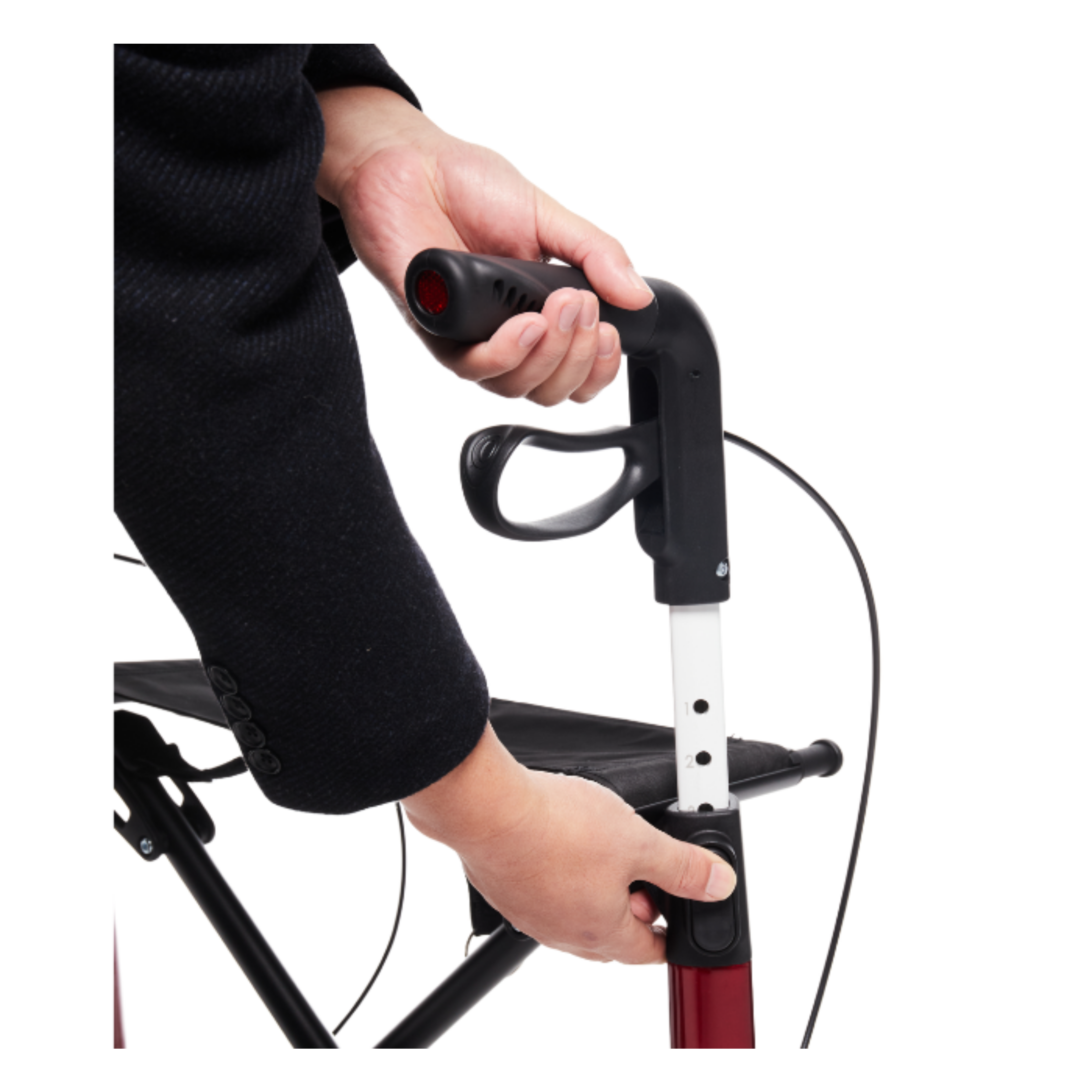Close‑up of a person holding a rollator handle with black grip, red brake lever and white adjustable support bar, shown on a white background to highlight design and features